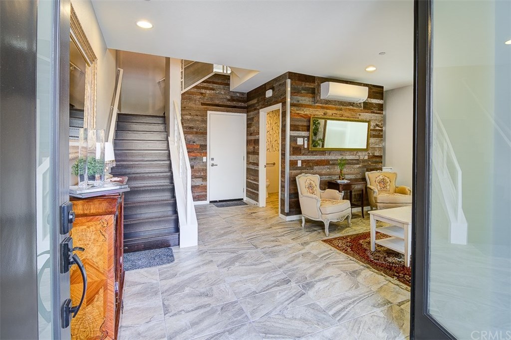 1678 Jetty Drive Costa Mesa, CA 92627 - Photo 11 of 72 First level, notice reclaimed wood walls, perfect space for office or light retail business.
