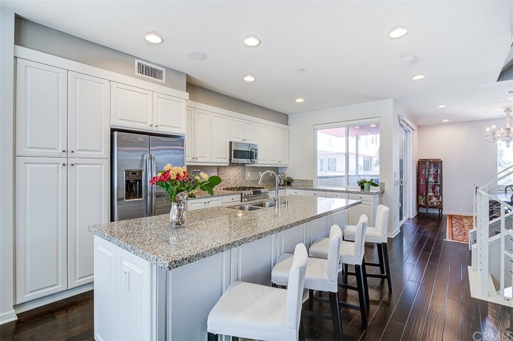 1678 Jetty Drive Costa Mesa, CA 92627 - Photo 23 of 72 Kitchen Island, white thermafoil cabinets.