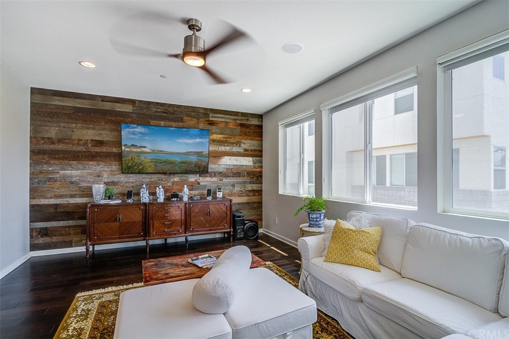1678 Jetty Drive Costa Mesa, CA 92627 - Photo 33 of 72 a living room with furniture and a flat screen tv