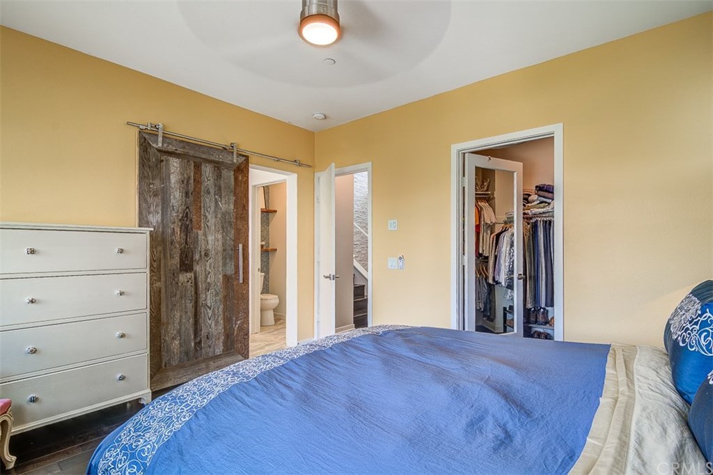 1678 Jetty Drive Costa Mesa, CA 92627 - Photo 40 of 72 a bedroom with a bed and a dresser