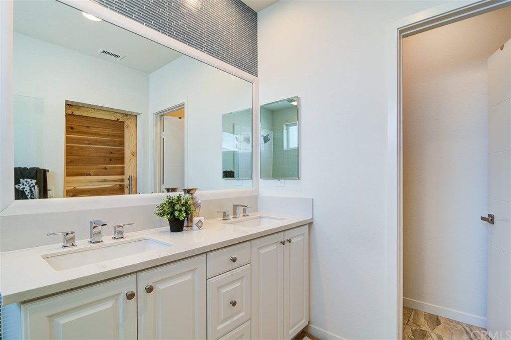1678 Jetty Drive Costa Mesa, CA 92627 - Photo 44 of 72 a bathroom with a sink and a mirror