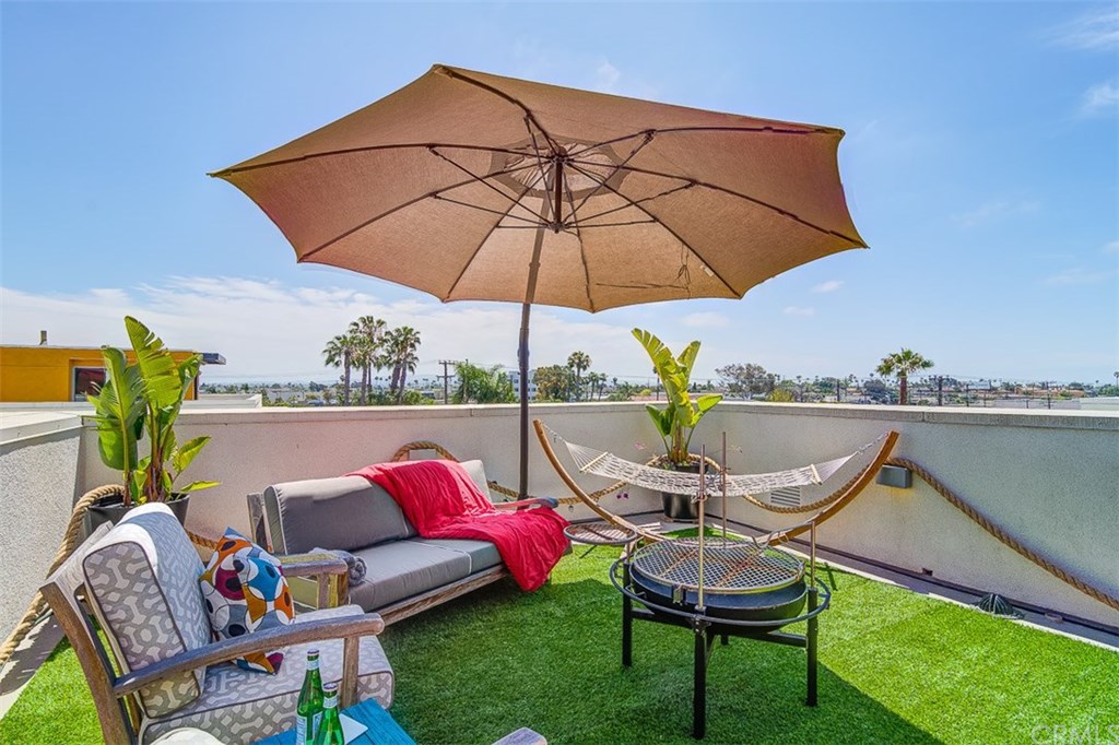 1678 Jetty Drive Costa Mesa, CA 92627 - Photo 55 of 72 a patio with a yard table and chairs