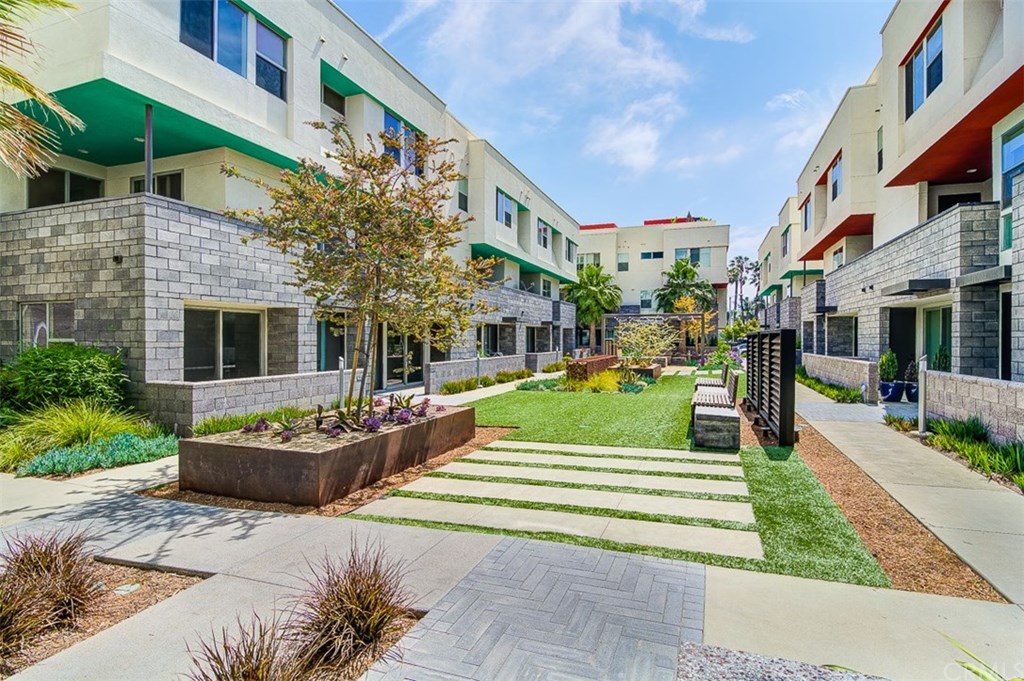 1678 Jetty Drive Costa Mesa, CA 92627 - Photo 7 of 72 a front view of a building with garden