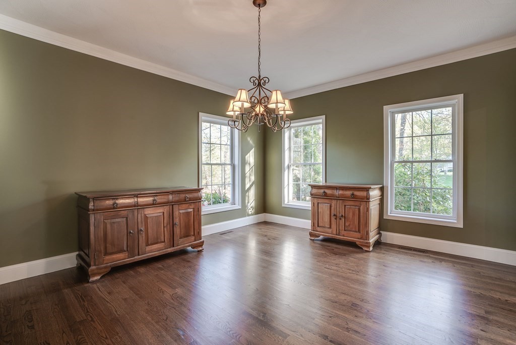 40 Partridge Road Windham, NH 03087 - Photo 13 of 42 an empty room with wooden floor and windows