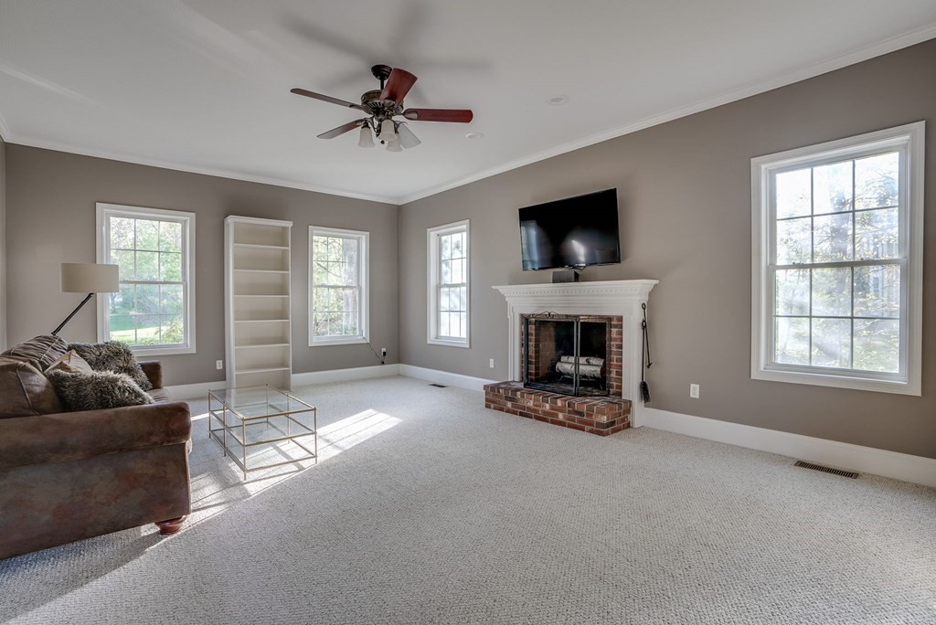 40 Partridge Road Windham, NH 03087 - Photo 24 of 42 a living room with furniture and a fireplace