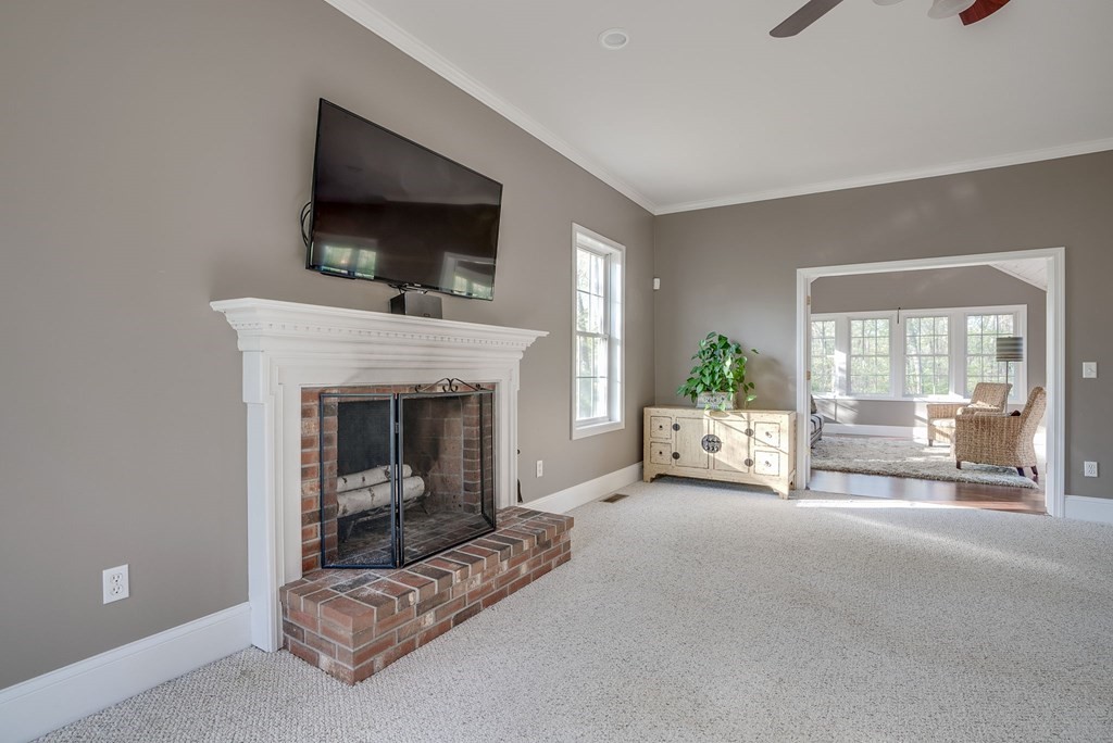 40 Partridge Road Windham, NH 03087 - Photo 25 of 42 a living room with furniture and a fireplace