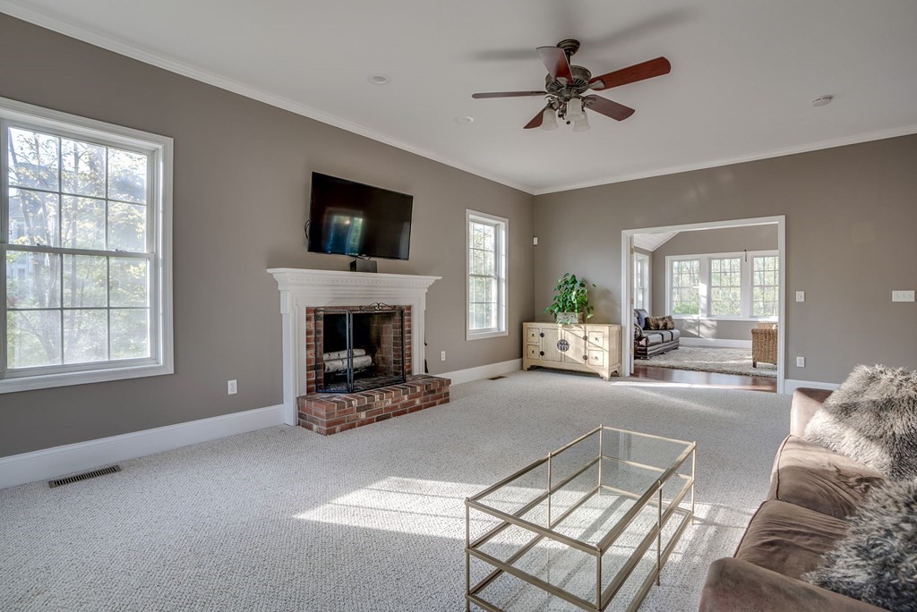 40 Partridge Road Windham, NH 03087 - Photo 26 of 42 a living room with furniture and a fireplace