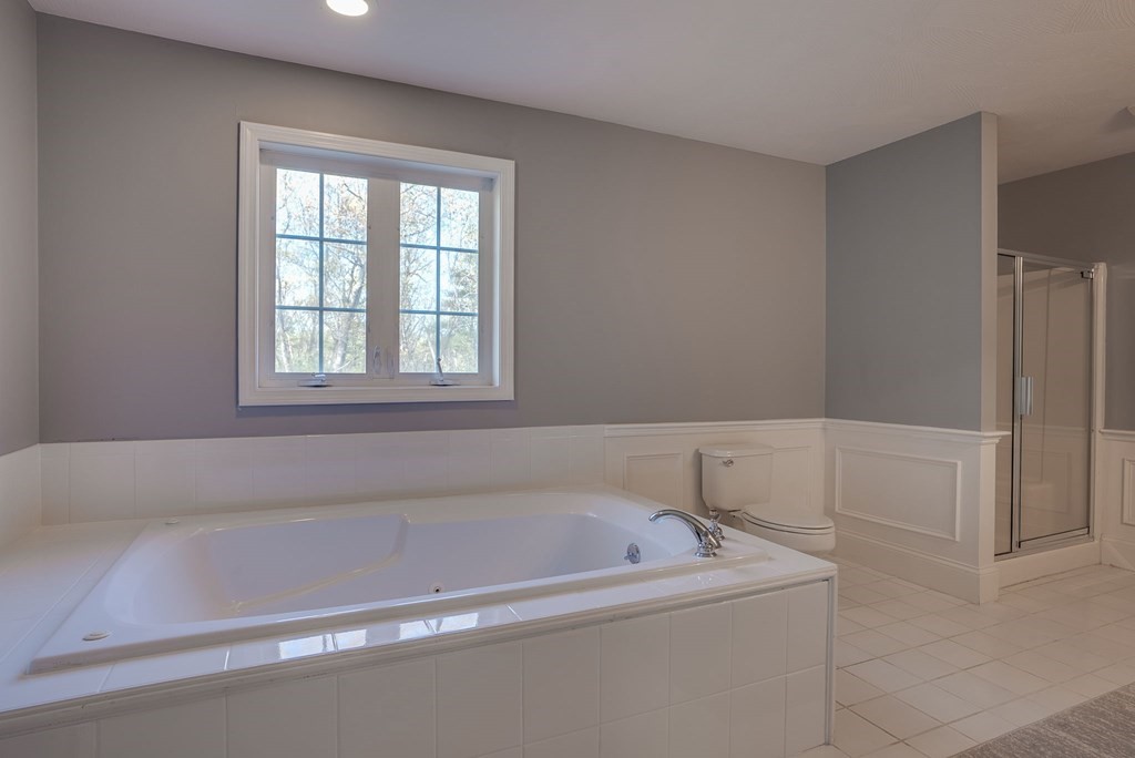 40 Partridge Road Windham, NH 03087 - Photo 35 of 42 a bathroom with bathtub and window