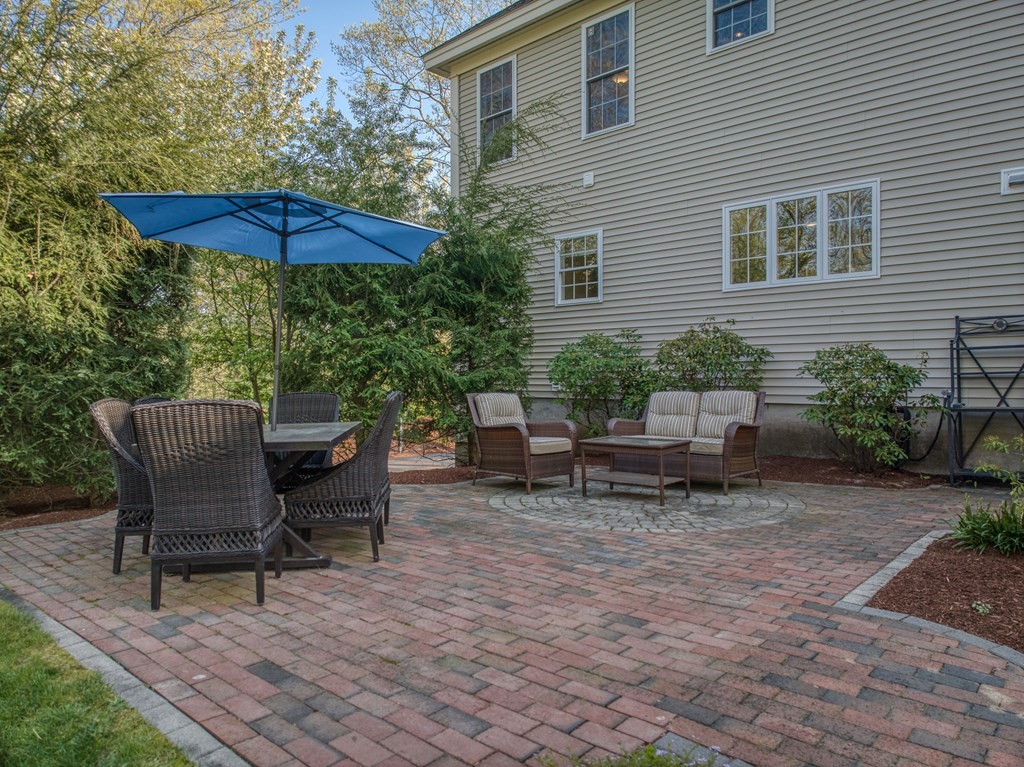 40 Partridge Road Windham, NH 03087 - Photo 6 of 42 a backyard of a house with table and chairs