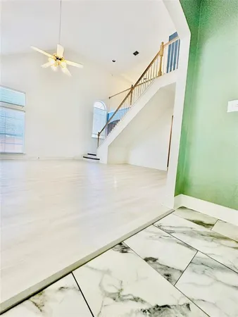 a view of a hallway view with staircase