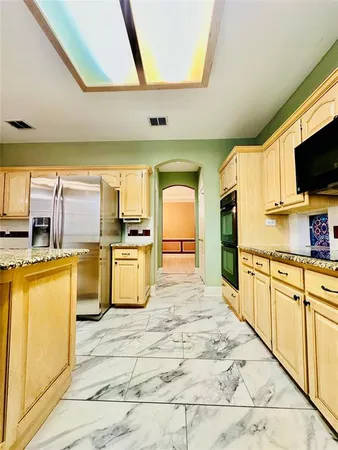 a view of a bathroom with a sink and a tub