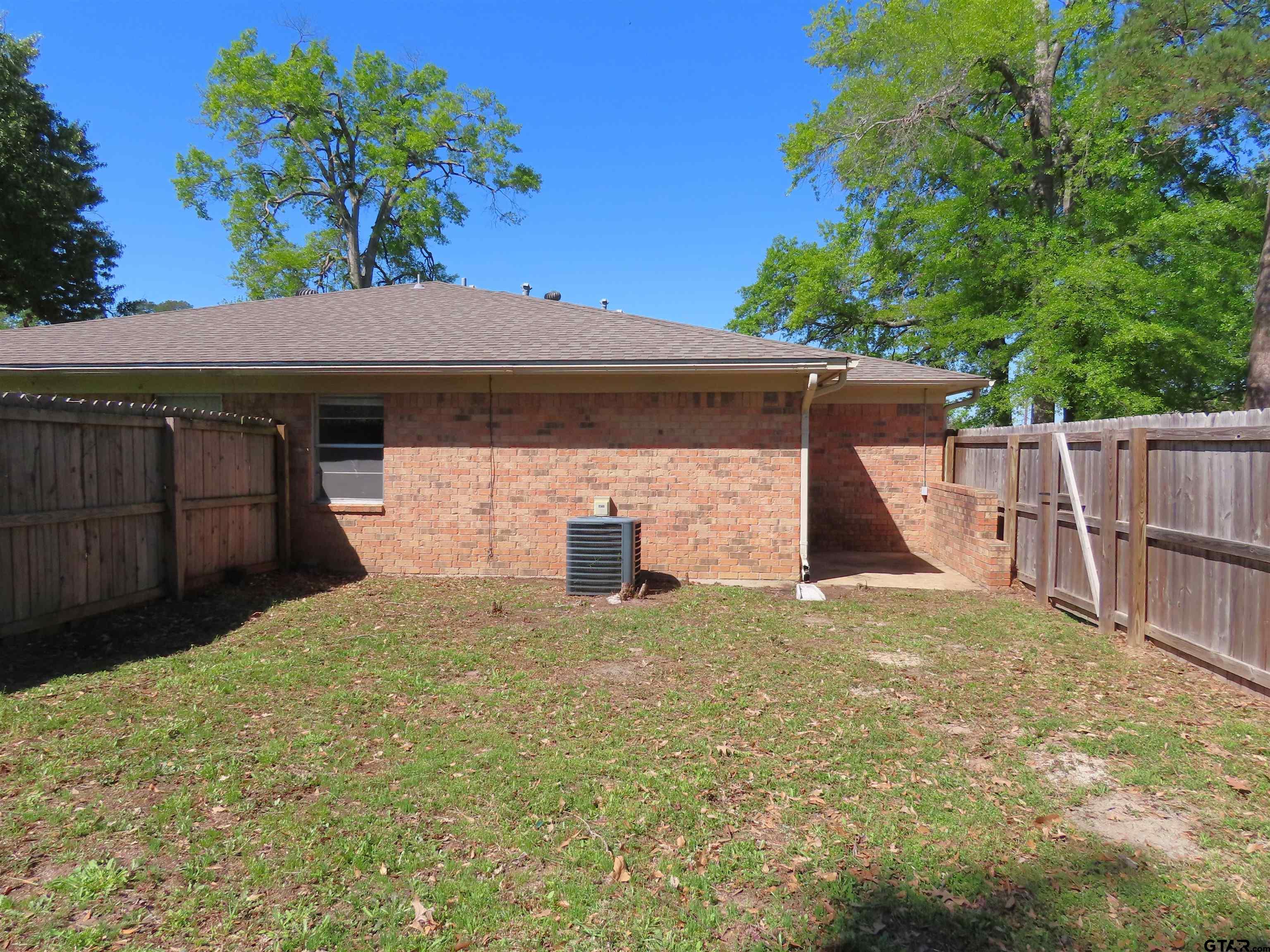 402 Muller Garden Road Tyler, TX 75703 - Photo 32 of 33 a view of a house with a garage