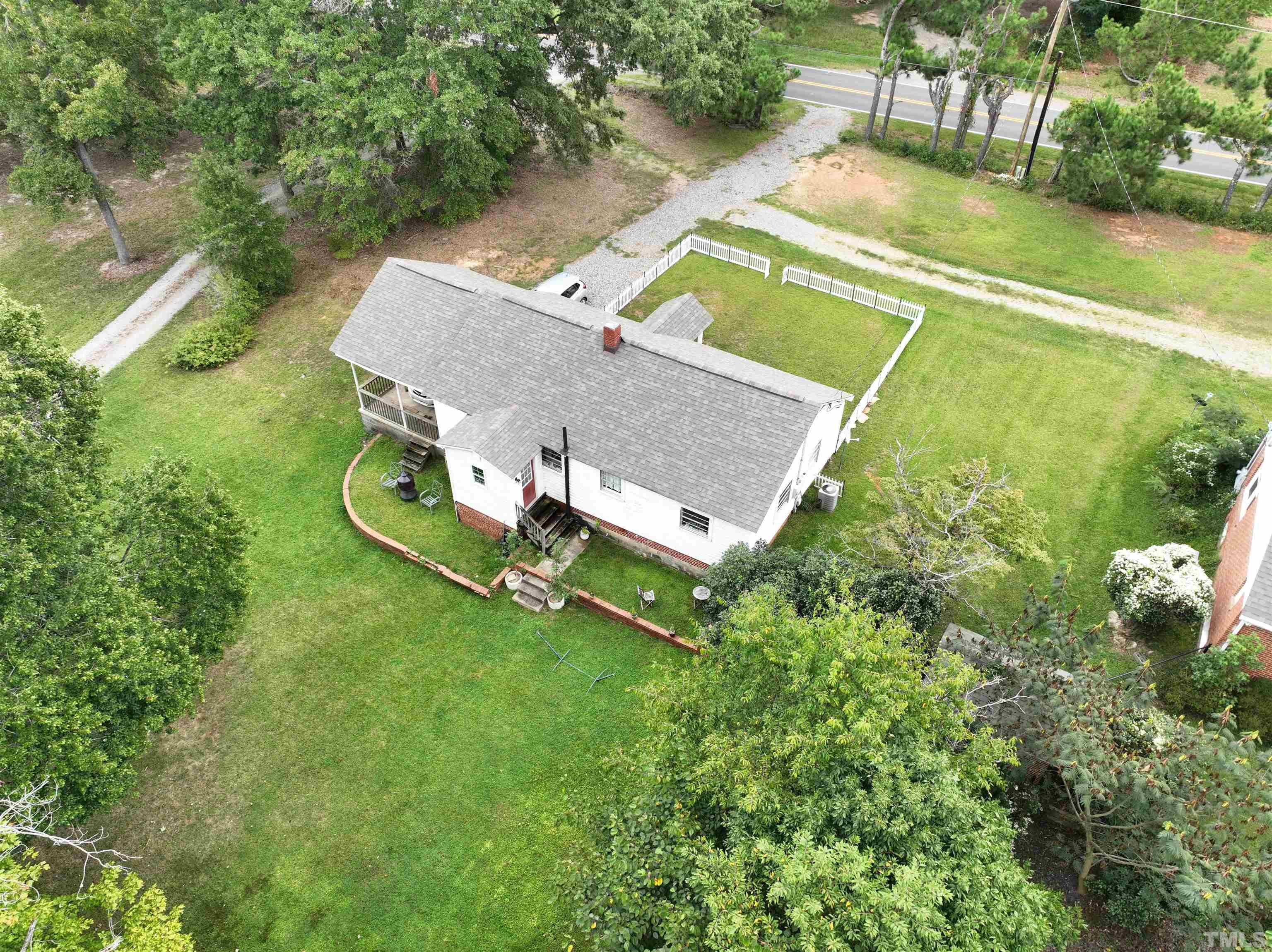 1539 Deep River Road Sanford, NC 27330 - Photo 18 of 34 an aerial view of a house with a yard basket ball court and outdoor seating