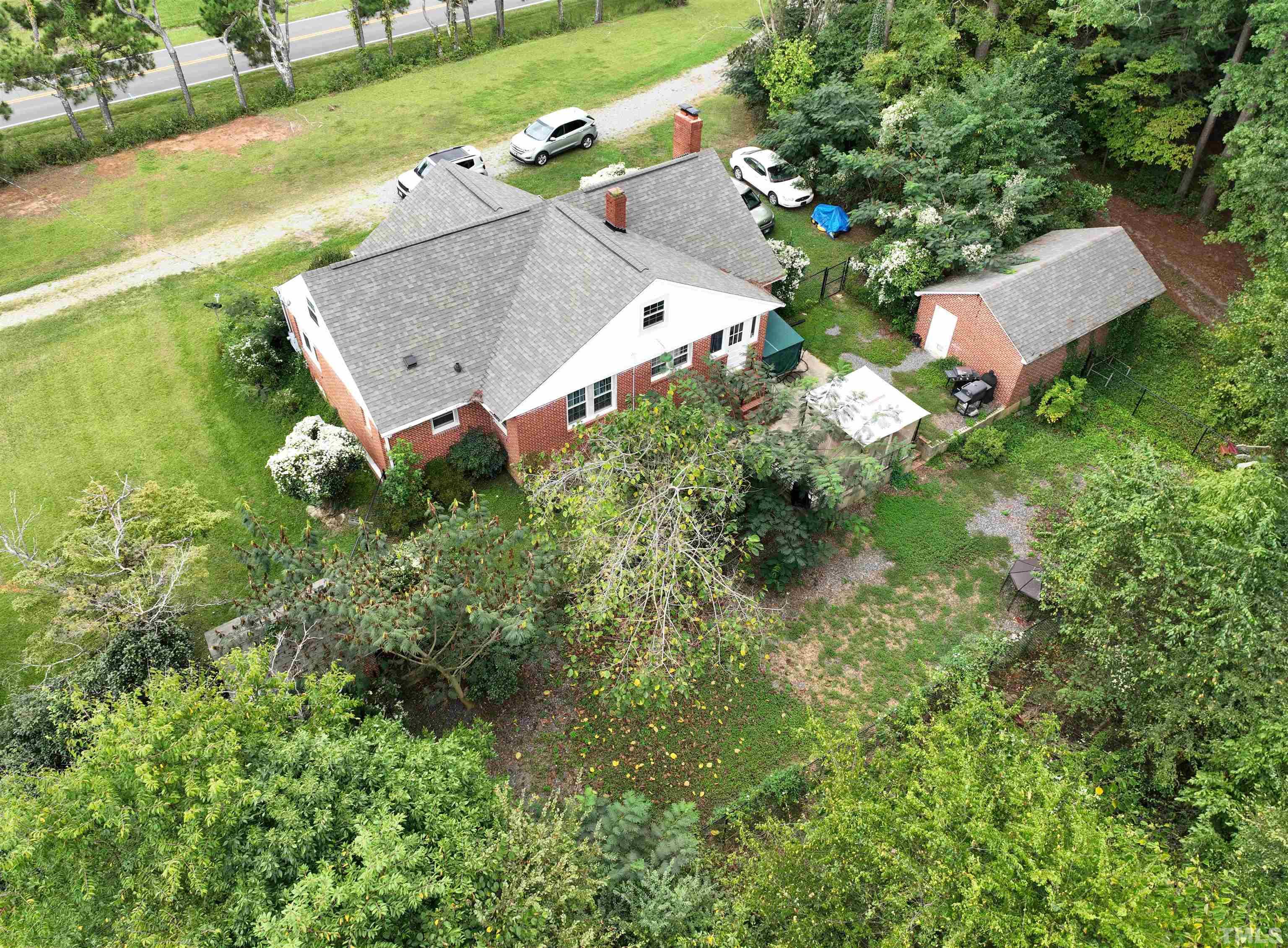 1539 Deep River Road Sanford, NC 27330 - Photo 19 of 34 an aerial view of a house with garden space and street view