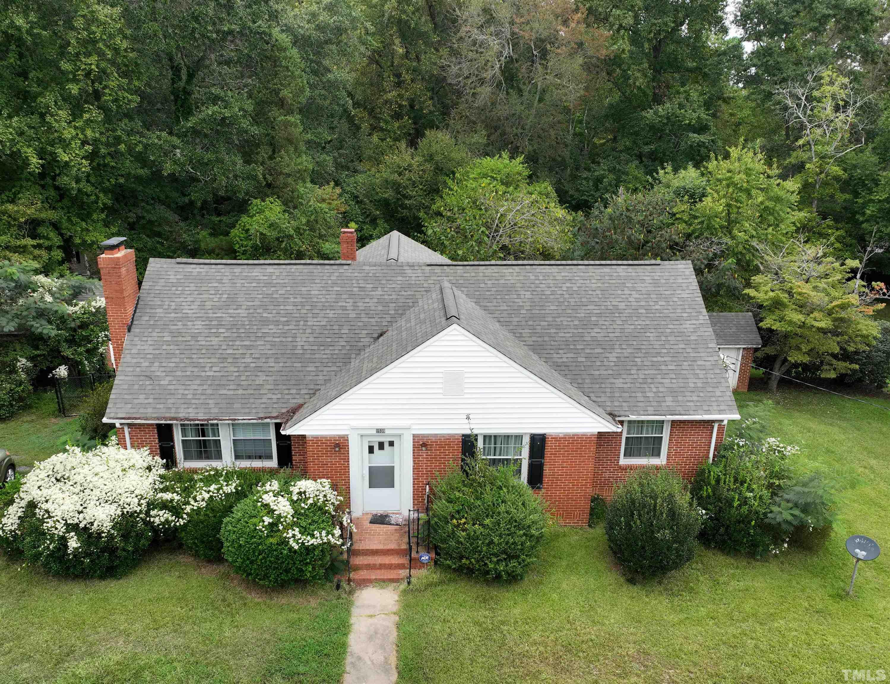 1539 Deep River Road Sanford, NC 27330 - Photo 2 of 34 aerial view of a house with a garden