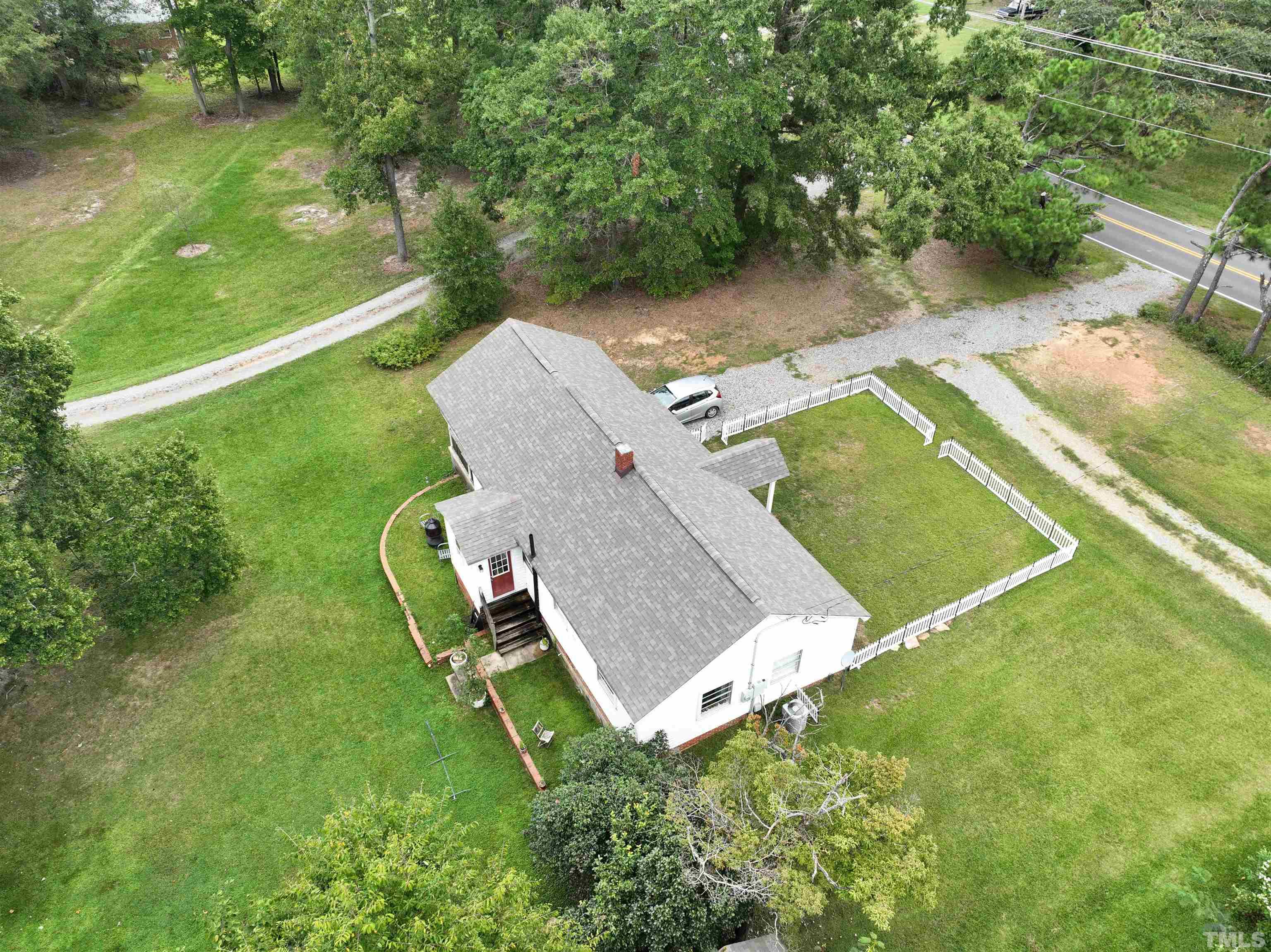 1539 Deep River Road Sanford, NC 27330 - Photo 23 of 34 an aerial view of a house with a yard