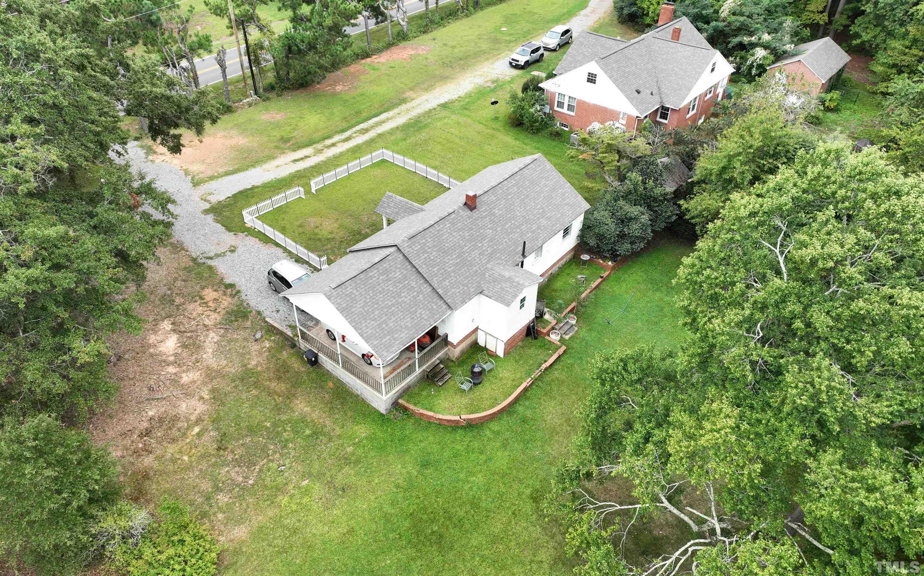 1539 Deep River Road Sanford, NC 27330 - Photo 25 of 34 an aerial view of a house with a yard and swimming pool