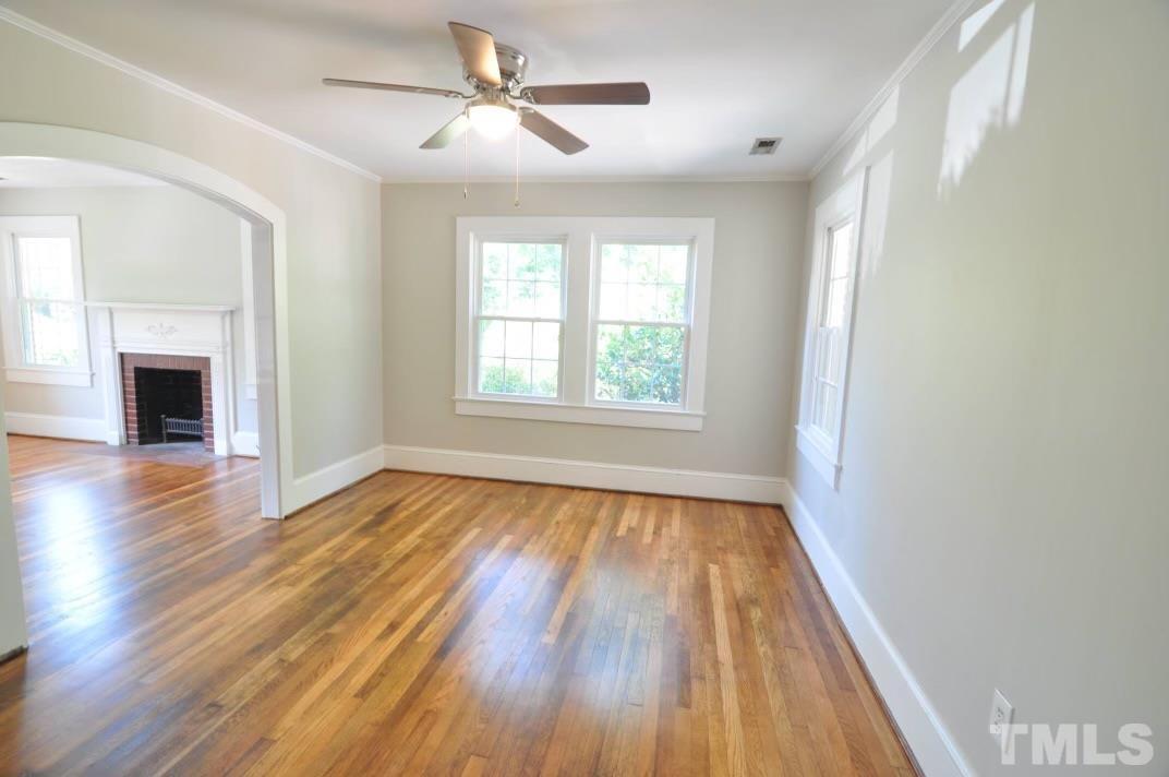 1539 Deep River Road Sanford, NC 27330 - Photo 29 of 34 wooden floor in an empty room with a window