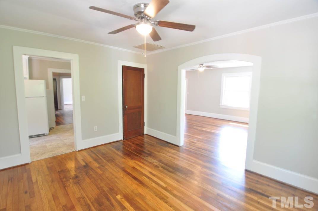 1539 Deep River Road Sanford, NC 27330 - Photo 30 of 34 wooden floor in an empty room with a window