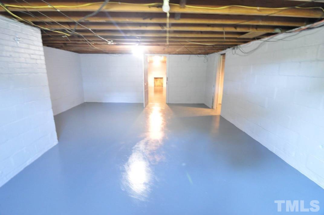 1539 Deep River Road Sanford, NC 27330 - Photo 32 of 34 a view of a hallway with wooden floor