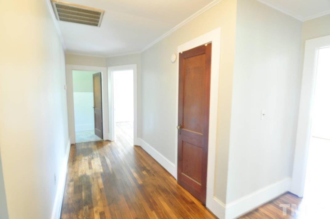 1539 Deep River Road Sanford, NC 27330 - Photo 33 of 34 a view of hallway with shower and wooden floor