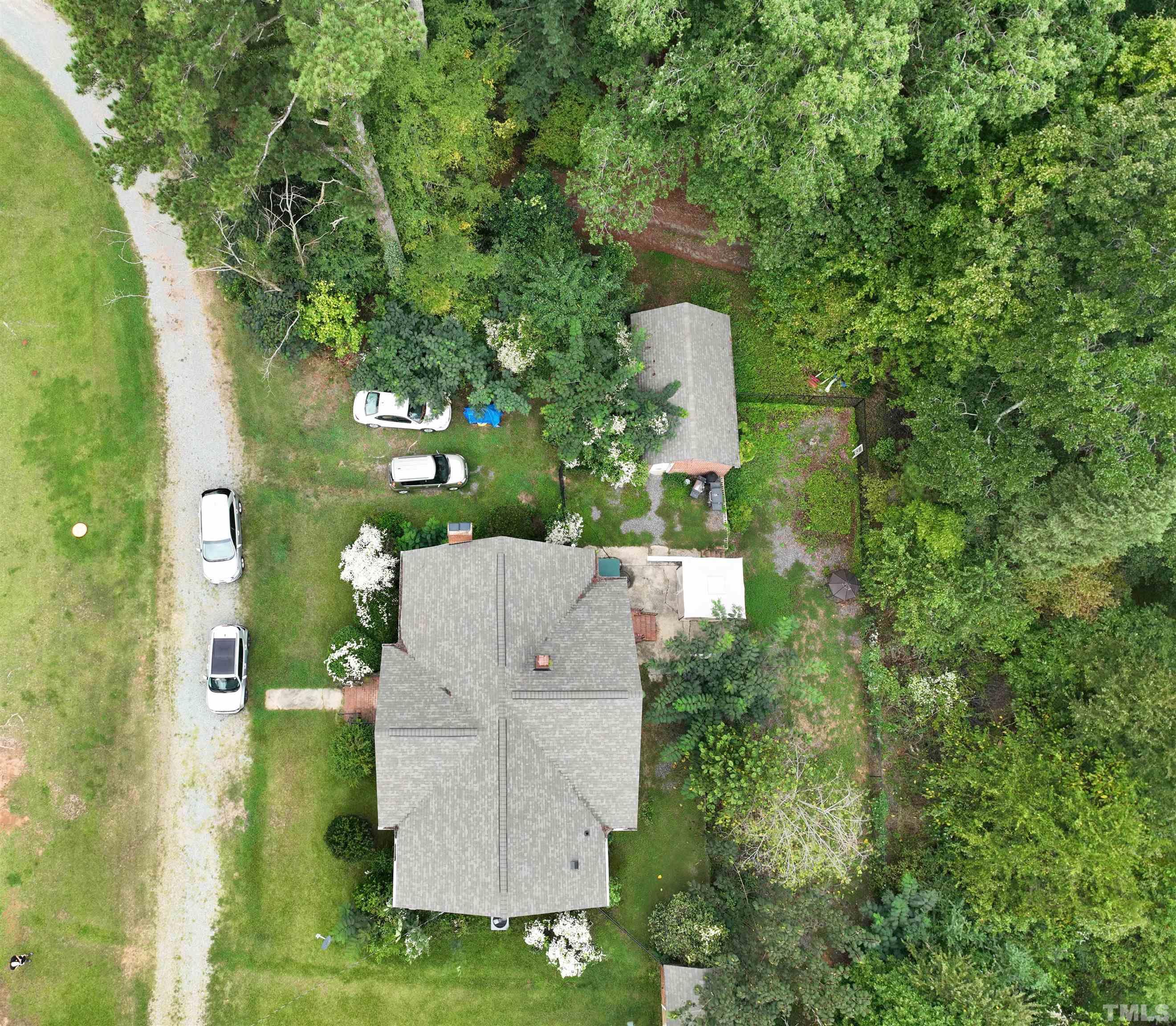 1539 Deep River Road Sanford, NC 27330 - Photo 4 of 34 an aerial view of a house with a yard