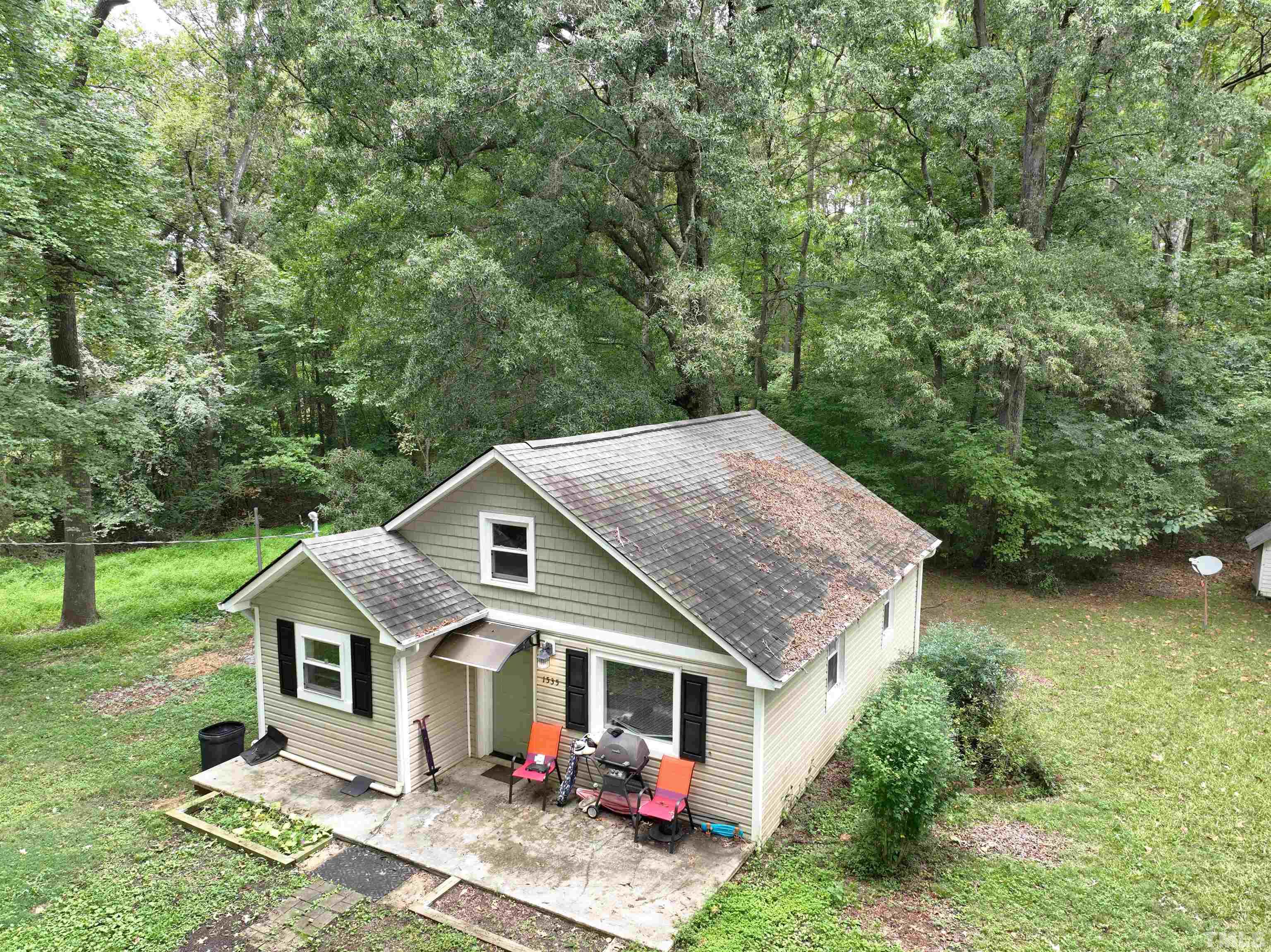 1539 Deep River Road Sanford, NC 27330 - Photo 10 of 34 a view of a house with backyard and garden