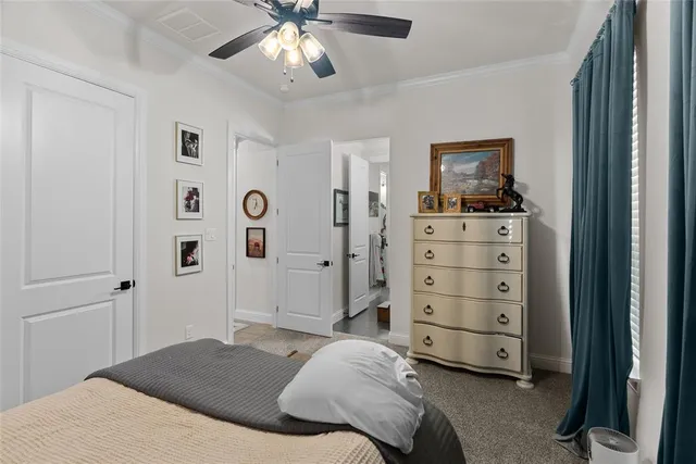 a bedroom with a bed and a tv