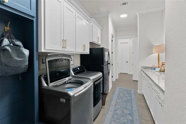 a kitchen with a stove sink and refrigerator