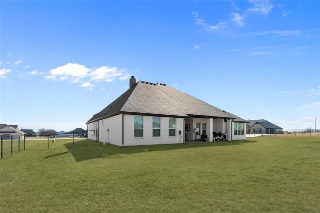 a view of a house with a big yard