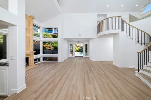 a view of livingroom with dining room and stairs
