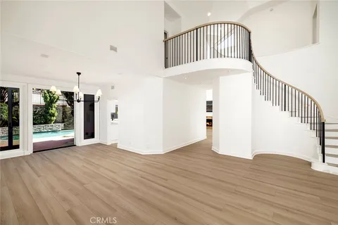 a view of an entryway with wooden floor