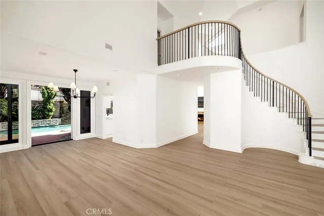 a view of an entryway with wooden floor