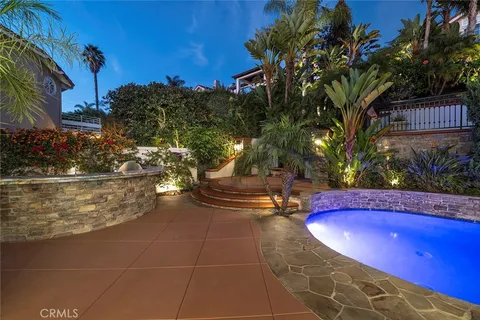 a view of an outdoor space pool patio and fire pit