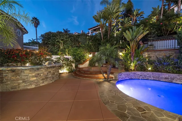 a view of an outdoor space pool patio and fire pit