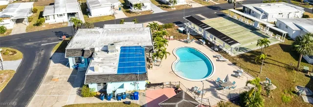 an aerial view of a house with a swimming pool