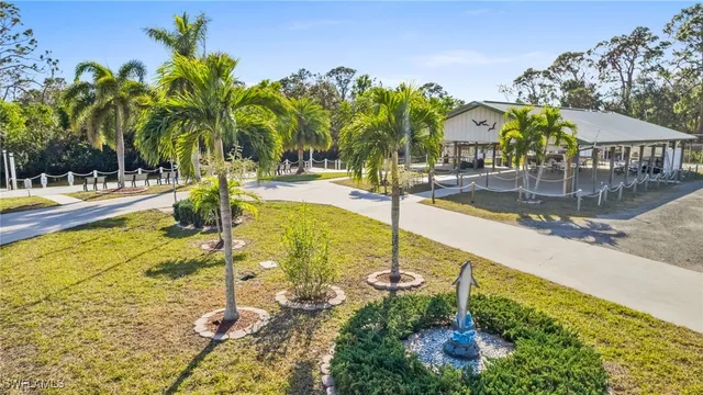 aerial view of a house with swimming pool and sitting area