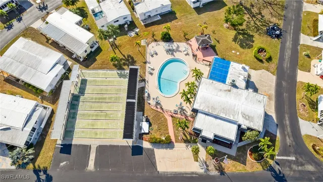 an aerial view of a house with a swimming pool