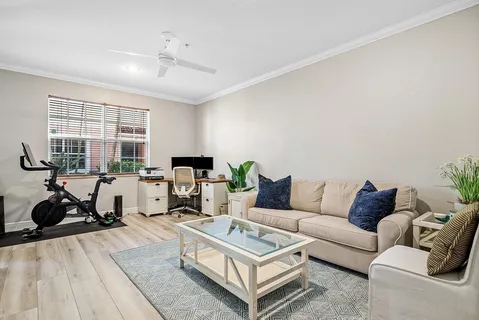 a view of a dining room with furniture wooden floor and a rug