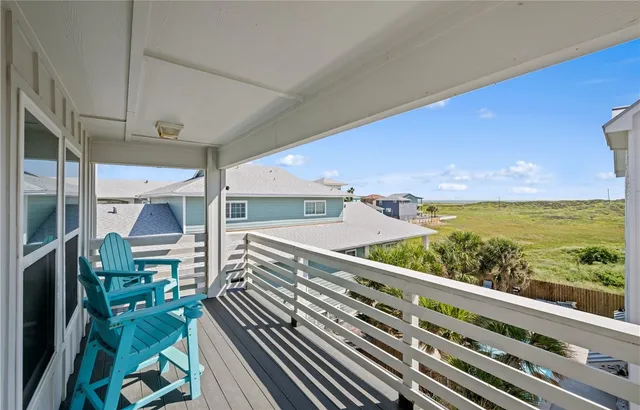 a view of a balcony with chairs