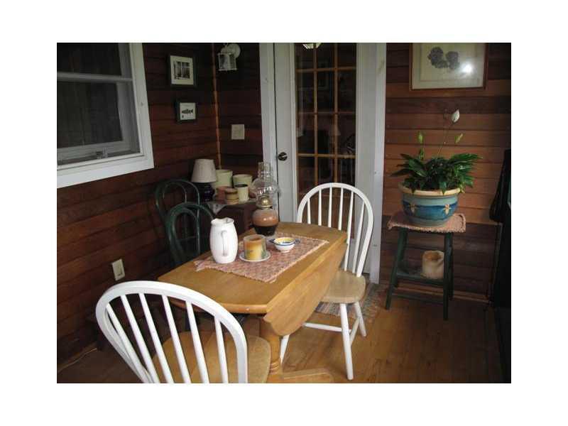 999 Pond Brook Road Rangeley, ME 04970 - Photo 25 of 28 Patio/Deck. Corner nook on screened...