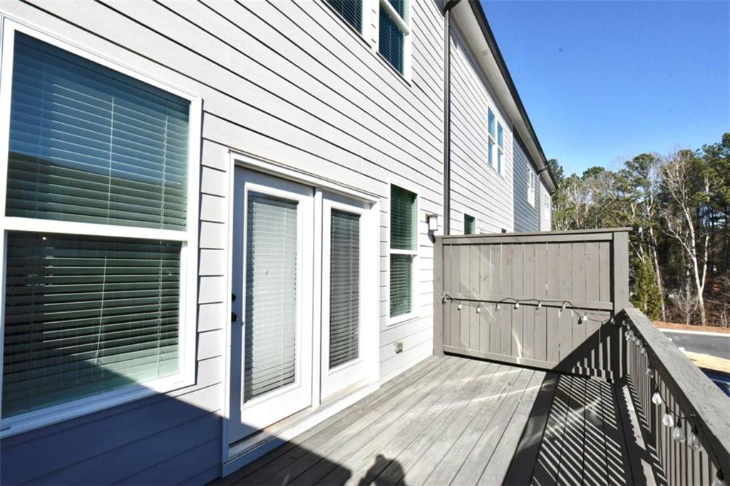 809 Cameron Trail Acworth, GA 30102 - Photo 12 of 38 a view of a house with backyard and wooden deck