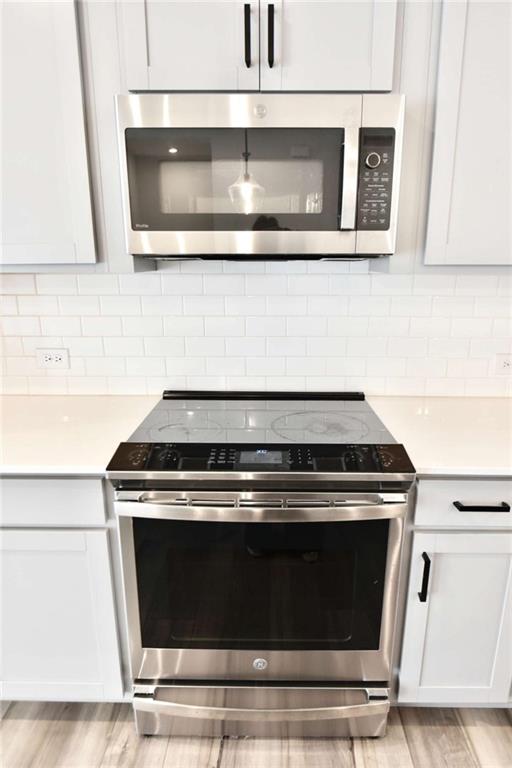 809 Cameron Trail Acworth, GA 30102 - Photo 15 of 38 a stove top oven sitting inside of a kitchen