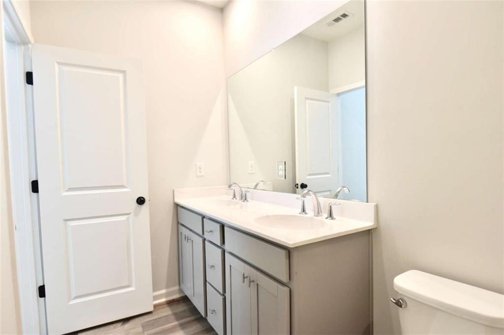 809 Cameron Trail Acworth, GA 30102 - Photo 25 of 38 a bathroom with a sink and a toilet