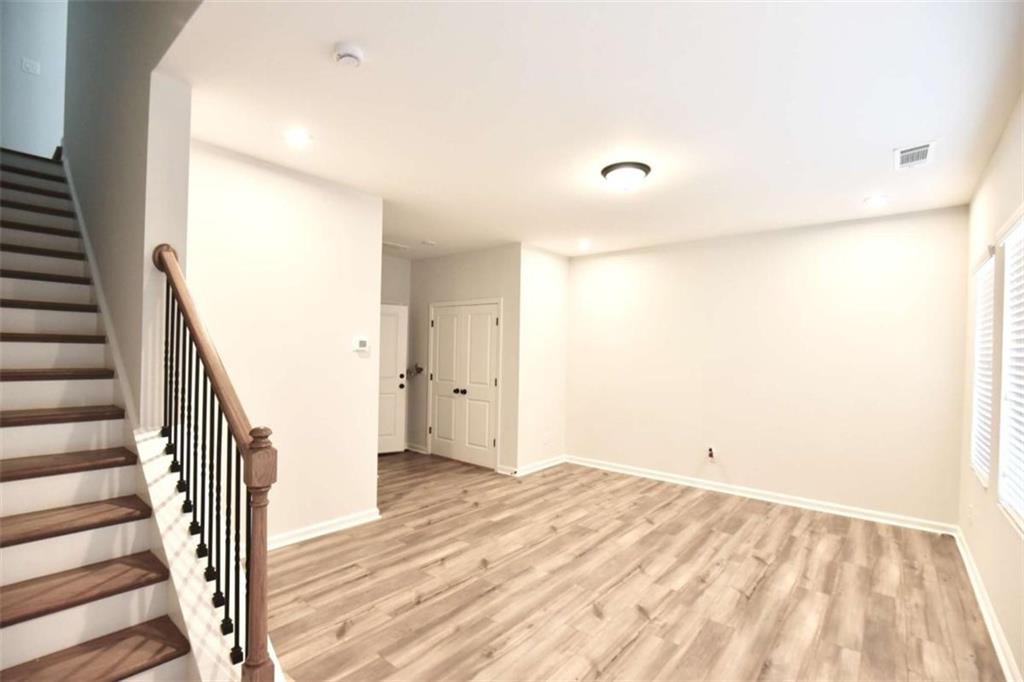 809 Cameron Trail Acworth, GA 30102 - Photo 31 of 38 a view of a room with wooden floor and stairs