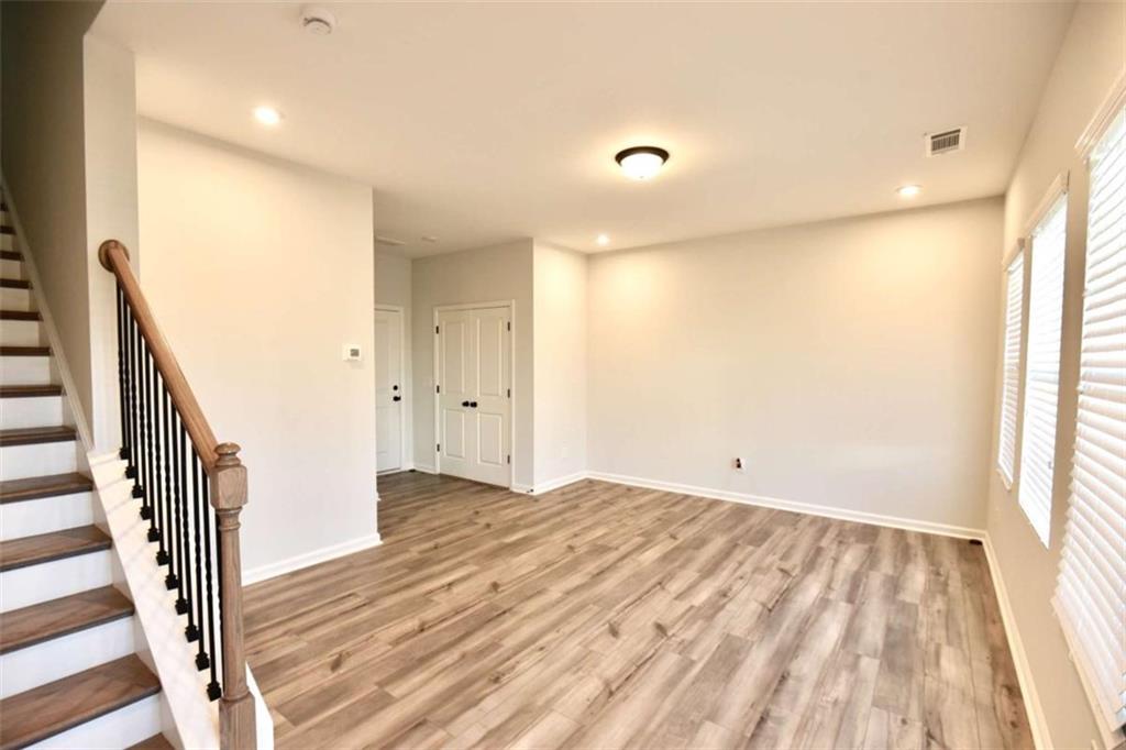 809 Cameron Trail Acworth, GA 30102 - Photo 5 of 38 a view of a room with wooden floor and stairs
