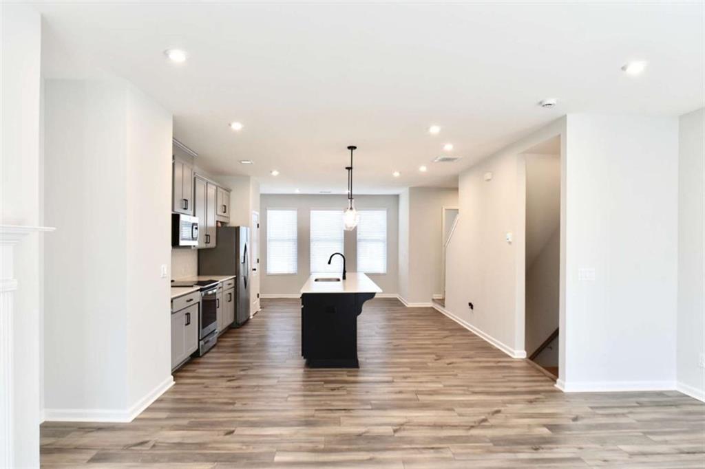 809 Cameron Trail Acworth, GA 30102 - Photo 10 of 38 a view of kitchen with sink microwave refrigerator and stove