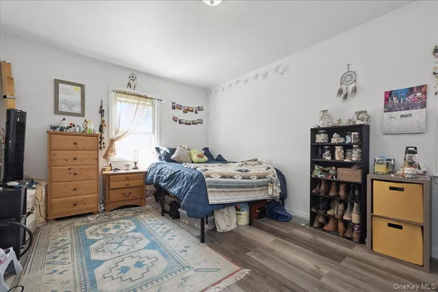 a bedroom with a bed and a bookshelf