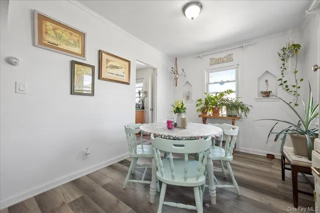 a view of a dining room with furniture and window