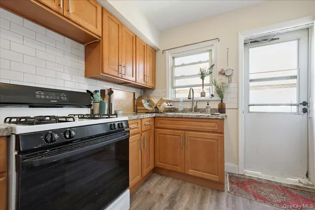 a kitchen with stainless steel appliances granite countertop a stove and a refrigerator